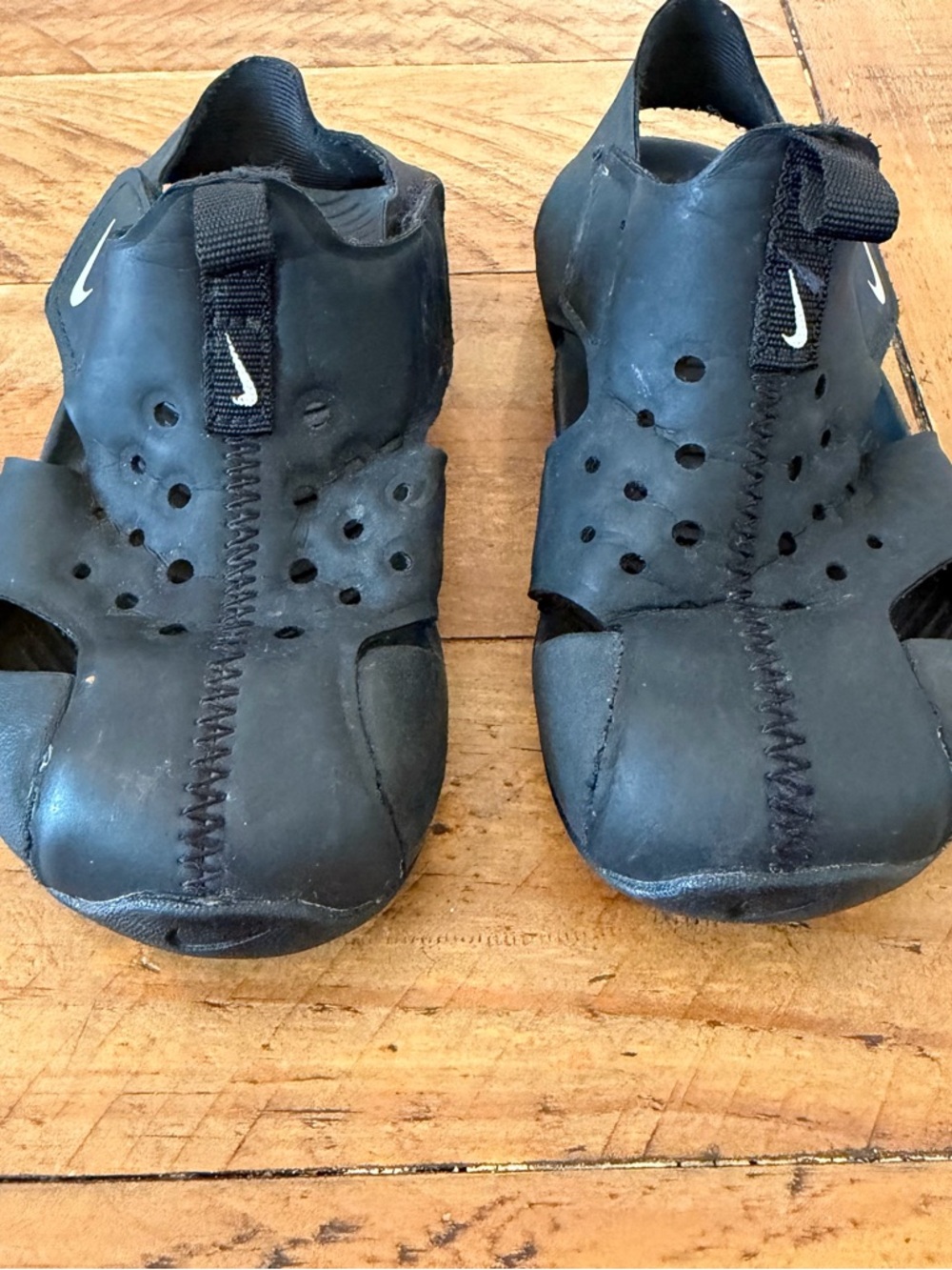 Nike Kids Black Slip-On Sandals with White Swoosh Accent